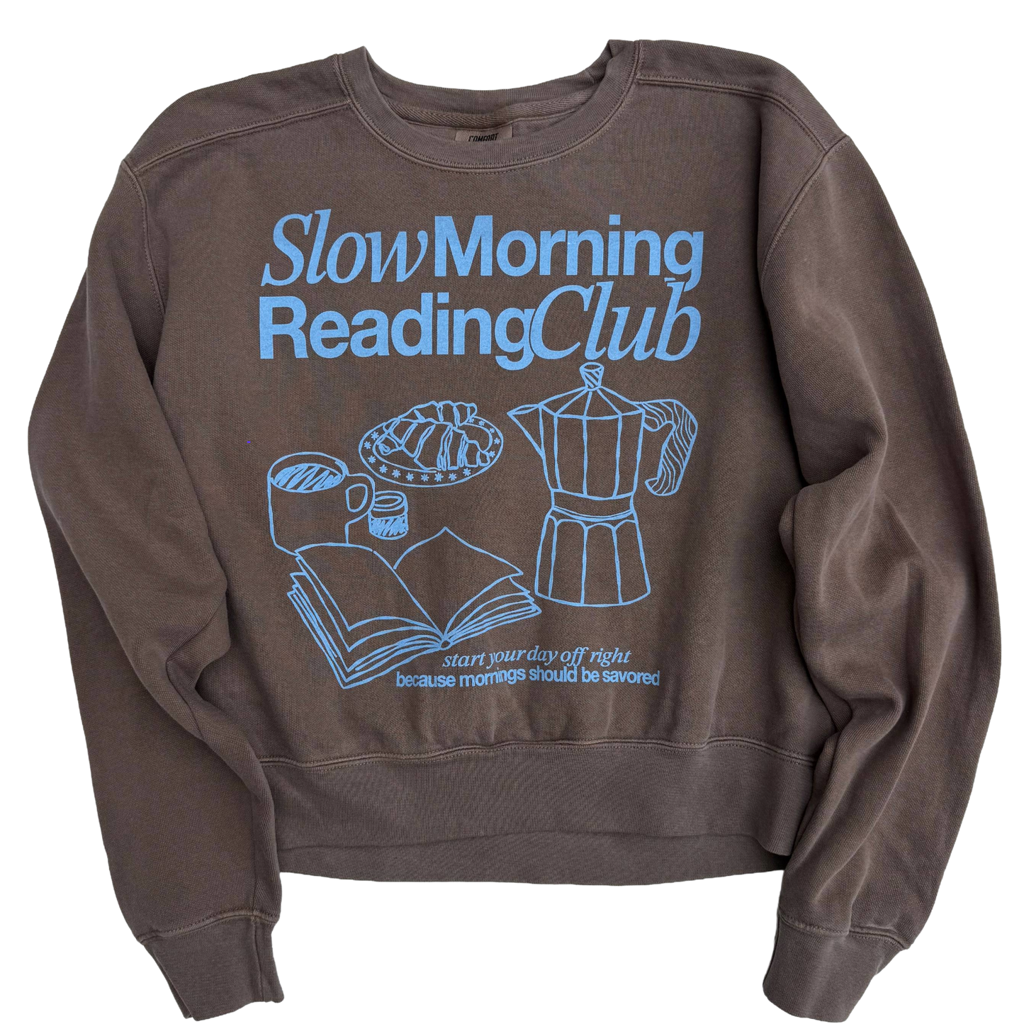 Brown sweatshirt with 'Slow Morning Reading Club' text and graphics