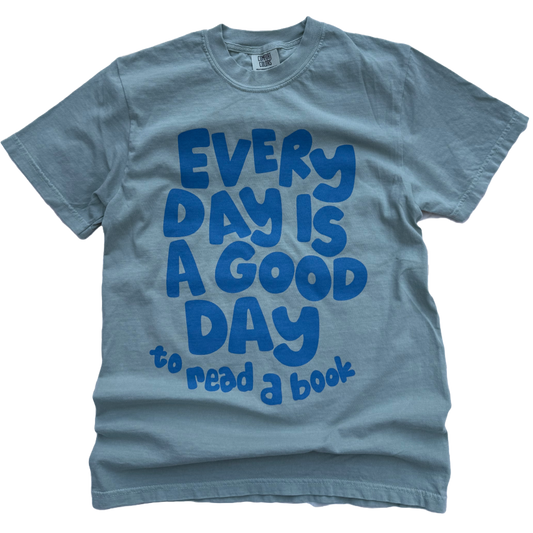 light green t-shirt with blue text Every Day is a Good Day to read a book