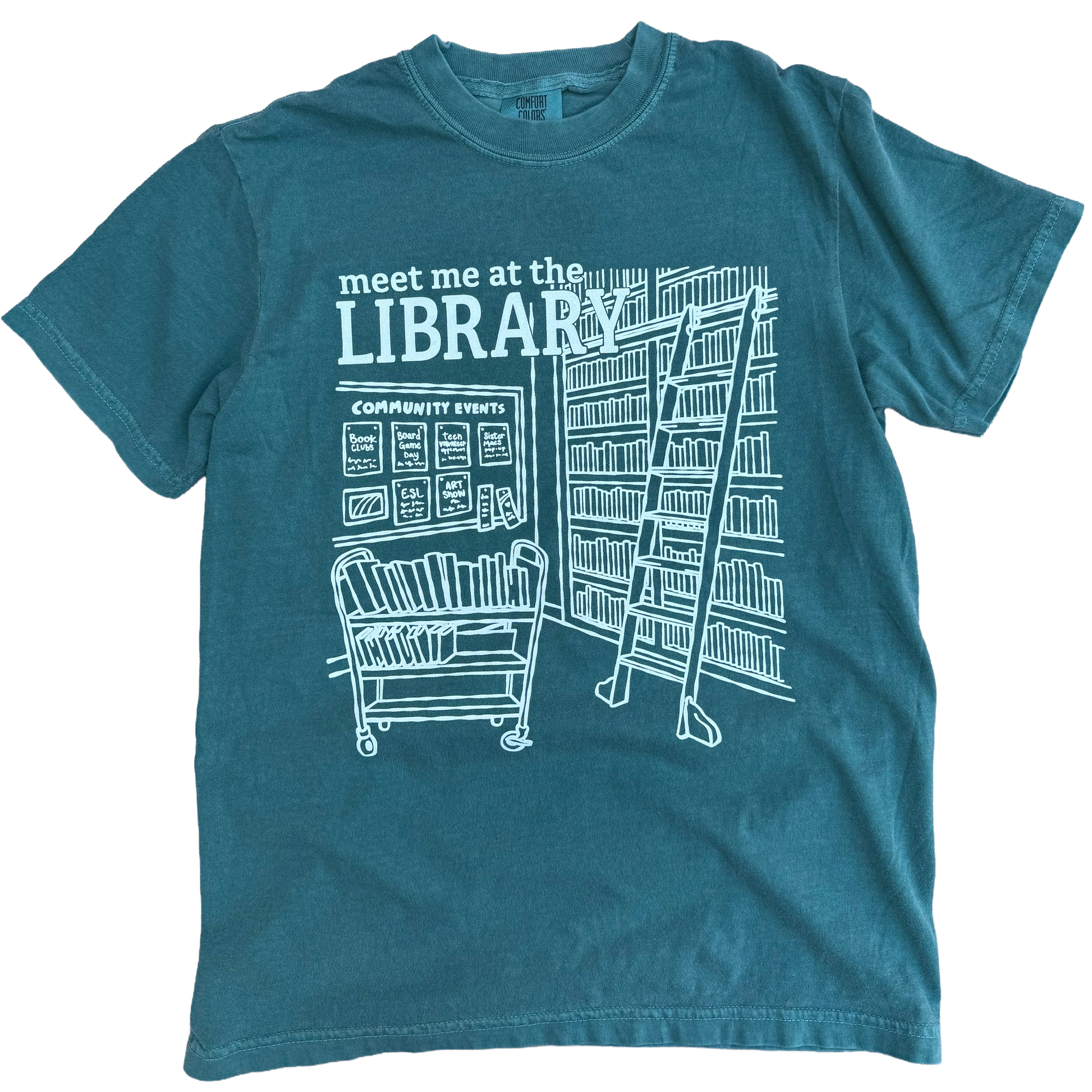 Teal t-shirt with white library graphic and text 'meet me at the LIBRARY'.